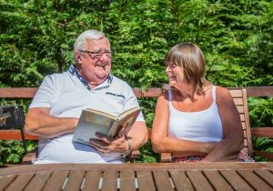 couple happy holiday sun summer holiday relax break book